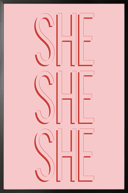 SHE poster in black frame